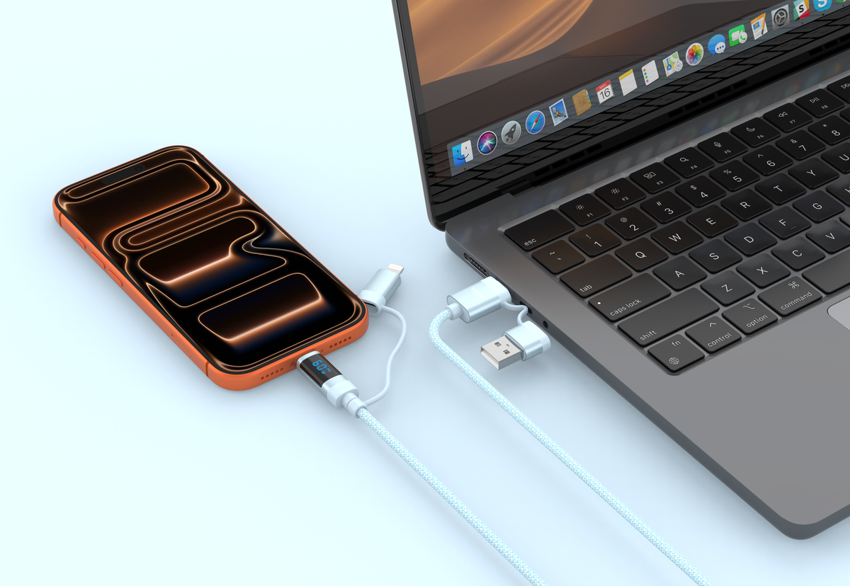 Tron multi-tip charging cable beside a laptop