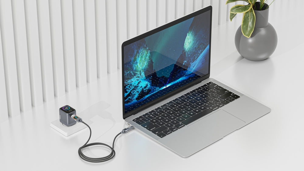 TRON 45W GaN wall charger charging a laptop on a desk